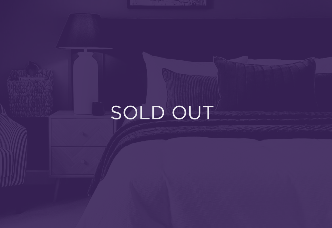 an image of a bedroom, with a purple overlay and text that says sold out