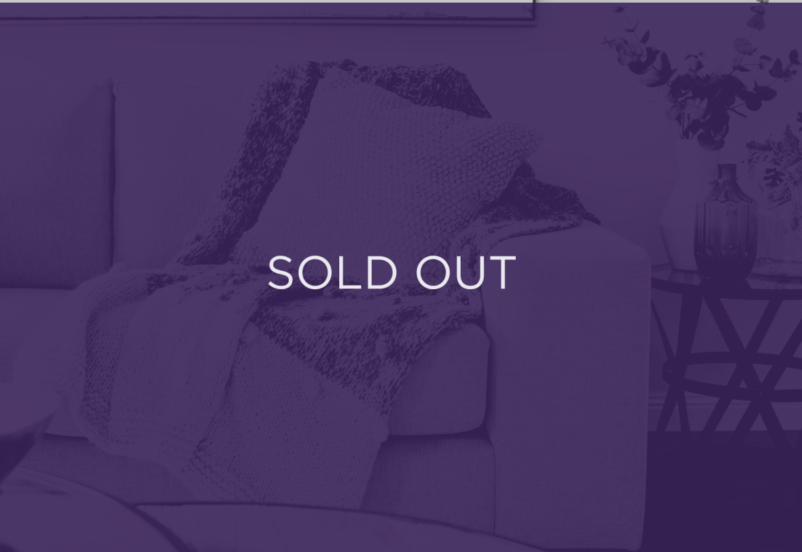 an image of a sofa, with a purple overlay and text that says sold out