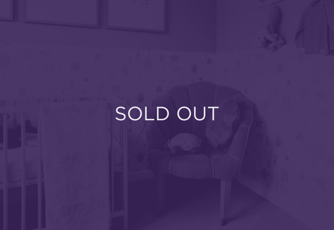 an image of a chair in a nursery, with a purple overlay and text that says sold out