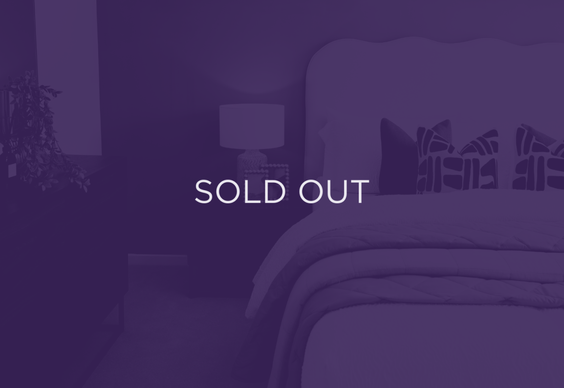 an image of a bed and bedside table, with a purple overlay and text that says sold out