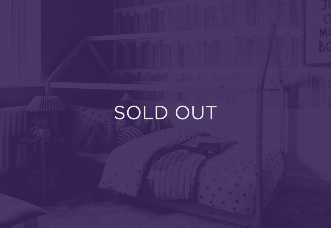 An image of a bed, with a purple overlay and text that says sold out
