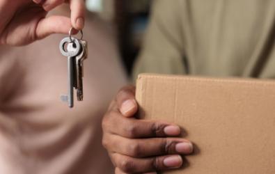 woman holding key