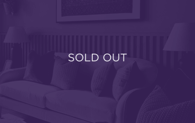 an image of a sofa, with a purple overlay and text that says sold out