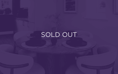 an image of a kitchen table, with a purple overlay and text that says sold out