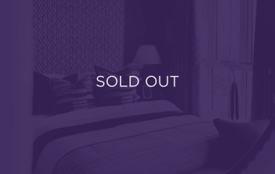 an image of a bed, with a purple overlay and text that says sold out