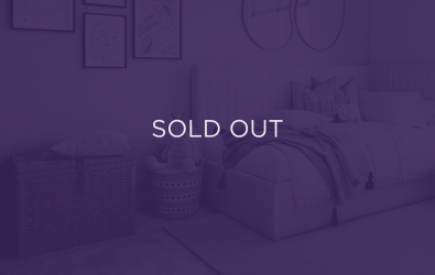 an image of a bedroom, with a purple overlay and text that says sold out