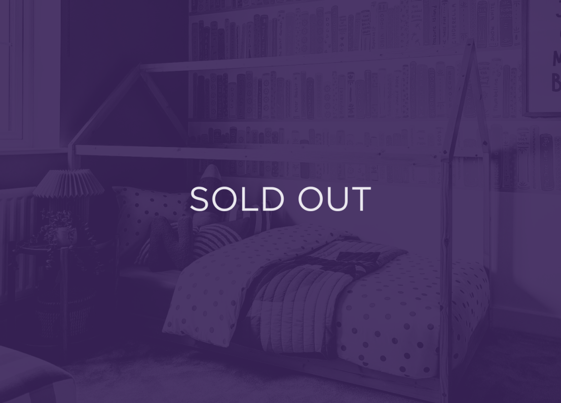 An image of a bed, with a purple overlay and text that says sold out